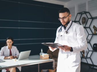 Concentrated coworkers working in hospital
